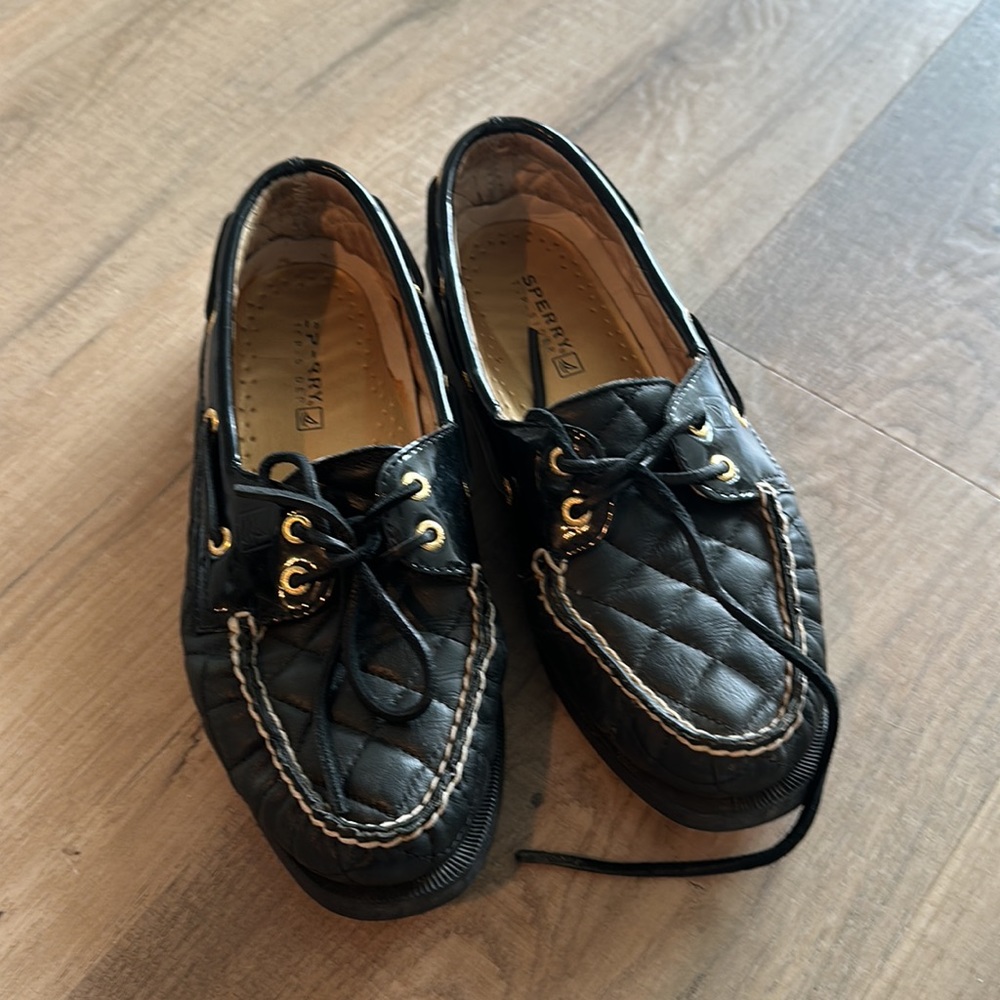 Black Sperry loafers with gold detail